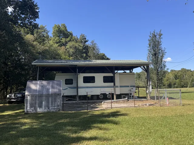 a view of a house with a yard porch and sitting area
