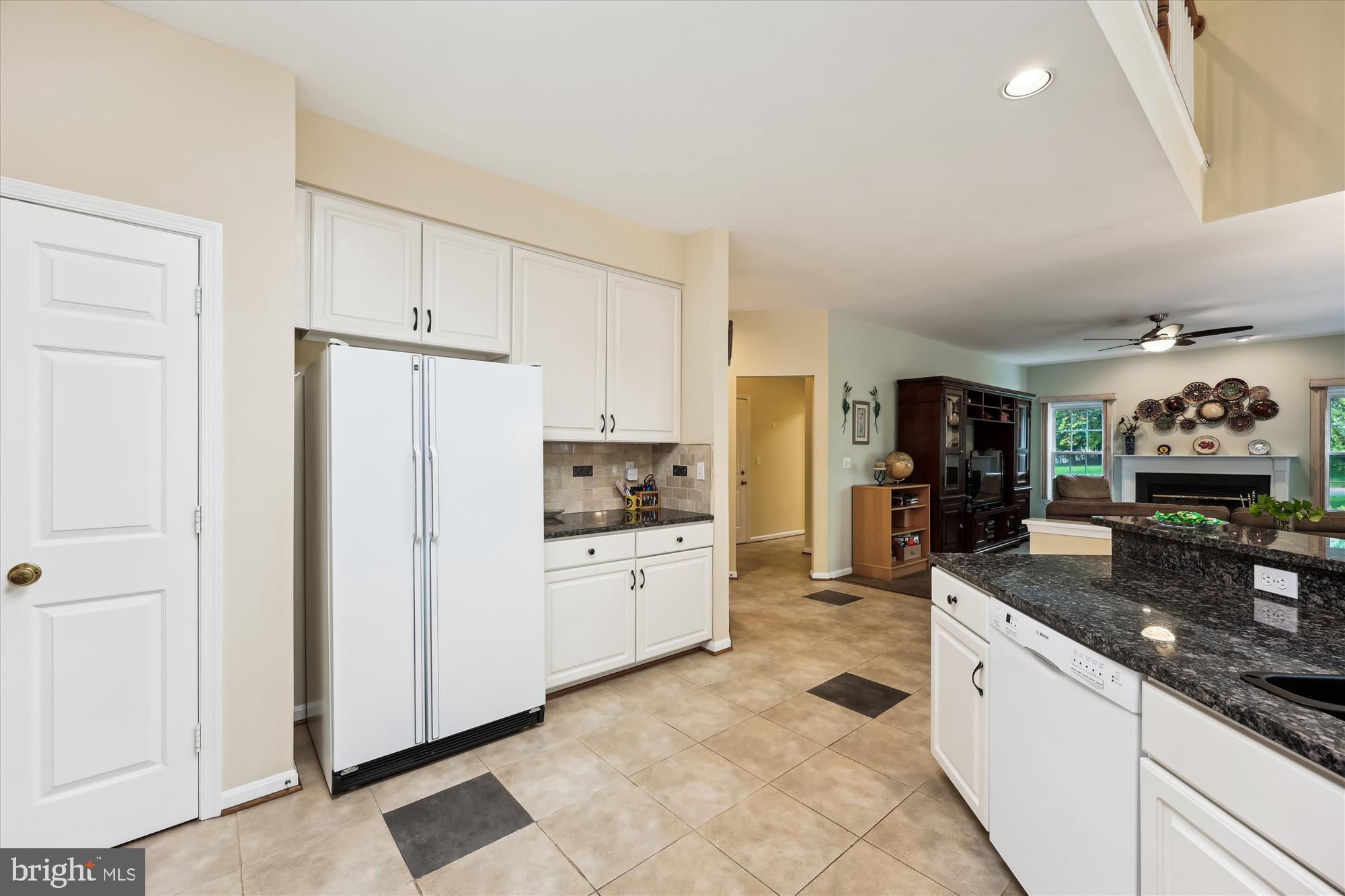 18717 Severn Road Gaithersburg, MD 20879 - Photo 16 of 44 a kitchen with granite countertop cabinets a sink a counter space and stainless steel appliances