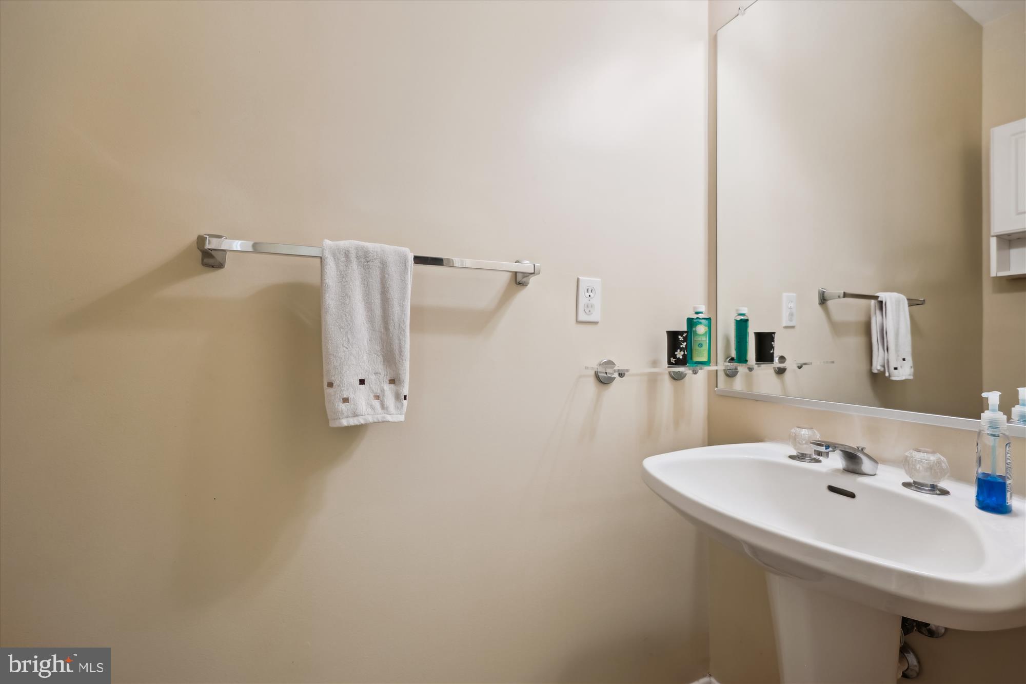18717 Severn Road Gaithersburg, MD 20879 - Photo 20 of 44 a bathroom with a sink a mirror and shower
