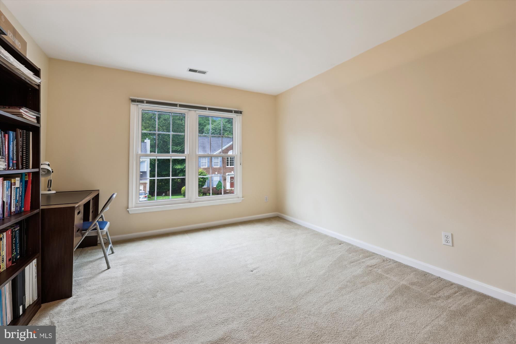 18717 Severn Road Gaithersburg, MD 20879 - Photo 33 of 44 an empty room with bookshelf and a window