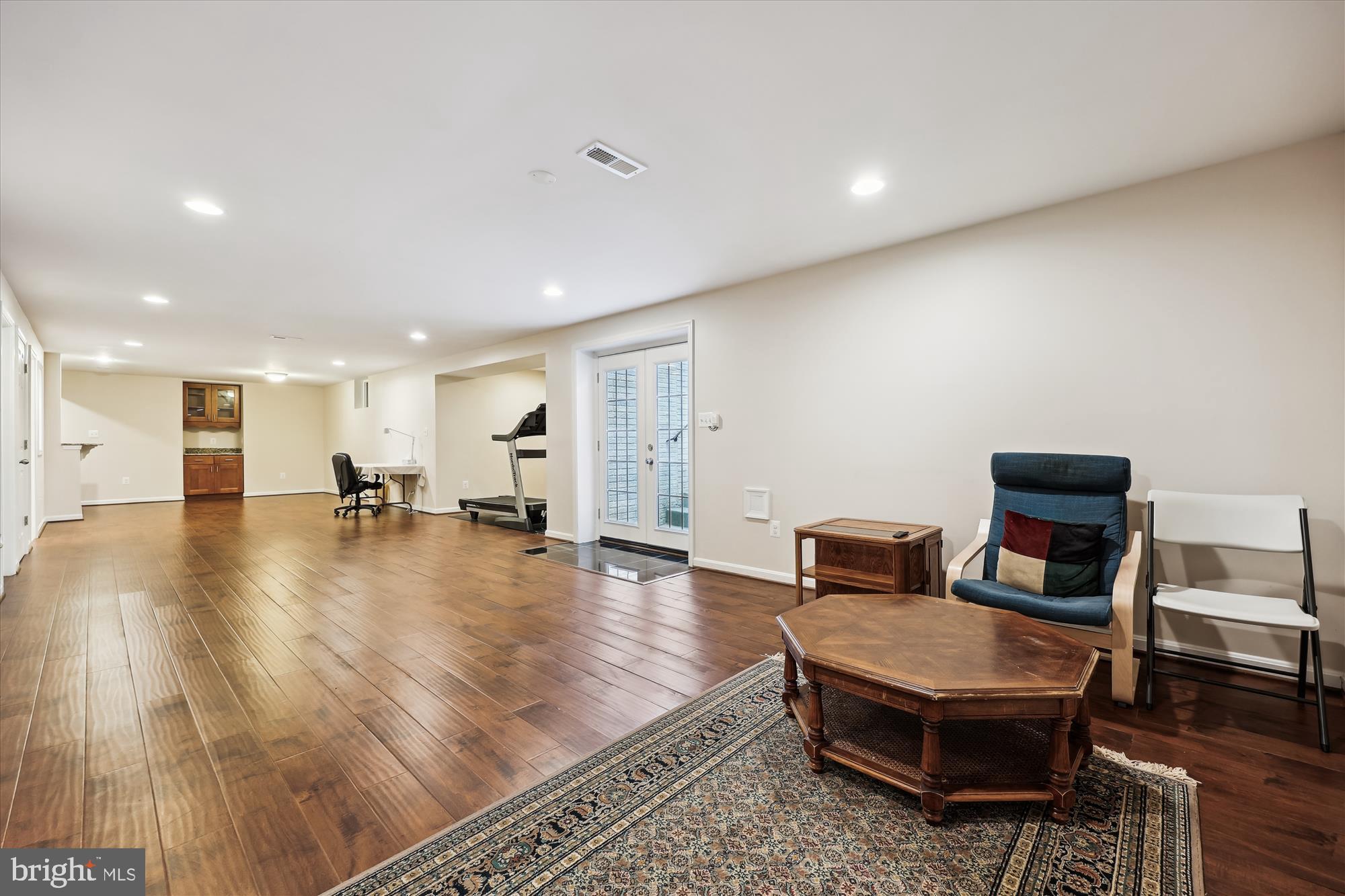18717 Severn Road Gaithersburg, MD 20879 - Photo 38 of 44 a living room with furniture and a table with wooden floor
