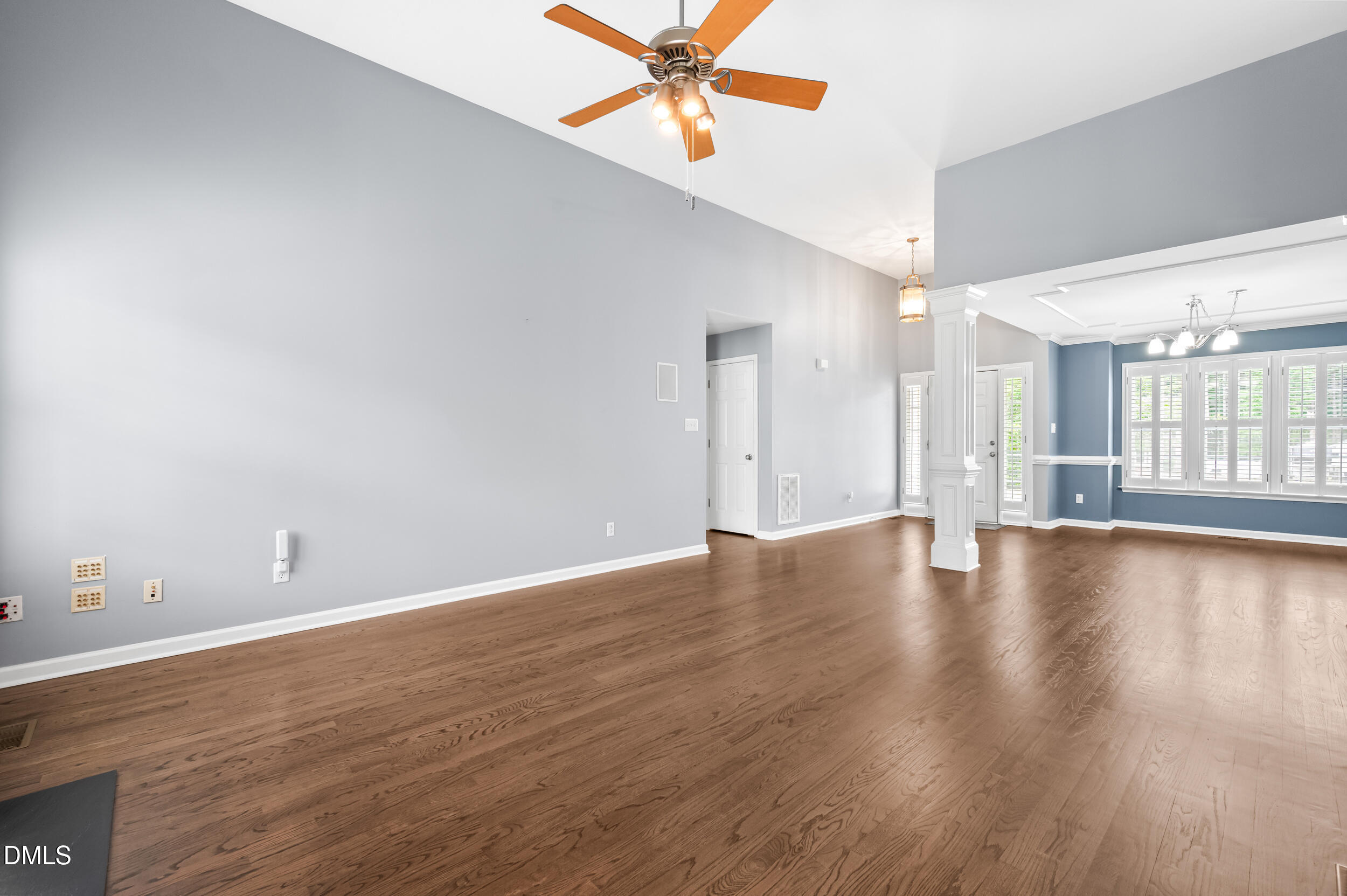 125 Rustic Lane Smithfield, NC 27577 - Photo 12 of 49 a view of an empty room with window and wooden floor