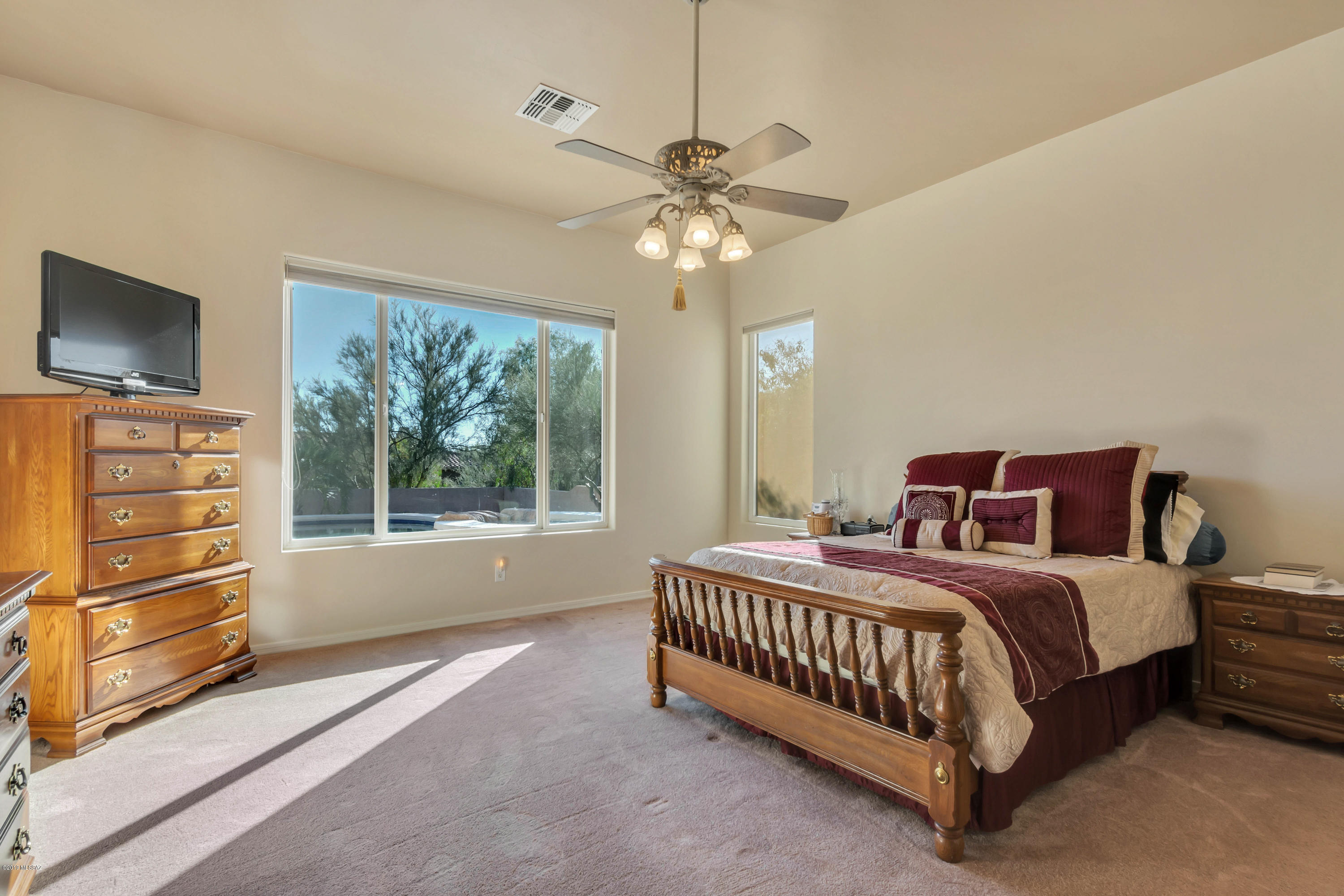 12682 North Spirit Mountain Road Oro Valley, AZ 85755 - Photo 36 of 40 a bedroom with a bed and a tv