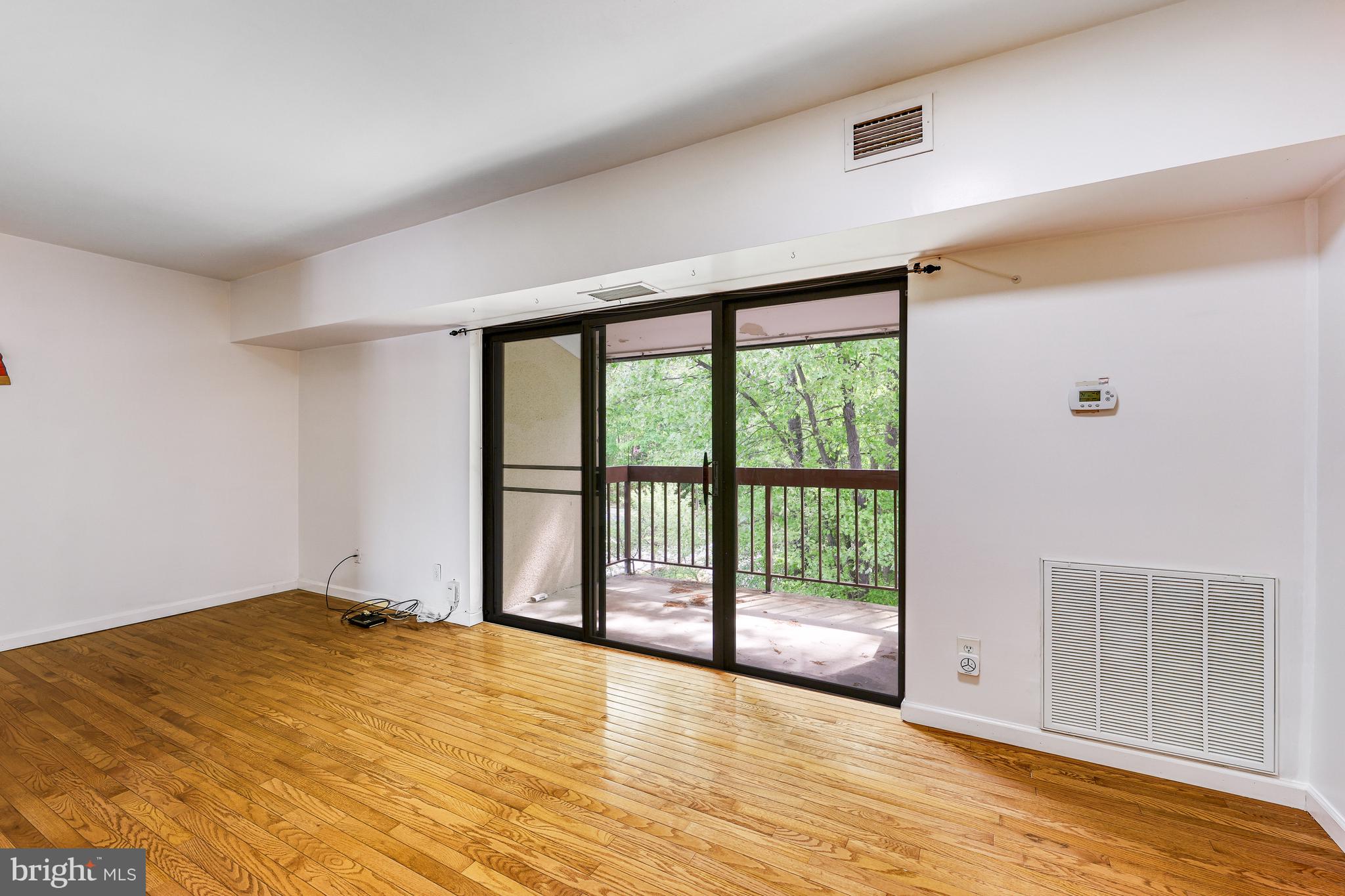 11601 Stoneview Square, Unit 21C Reston, VA 20191 - Photo 4 of 39 sliding door to large balcony