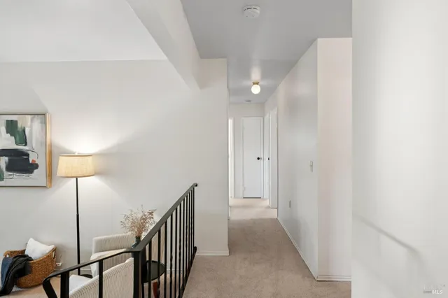 a view of hallway with wooden floor