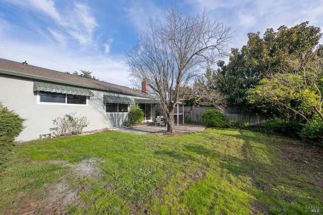 a front view of house with yard and seating area