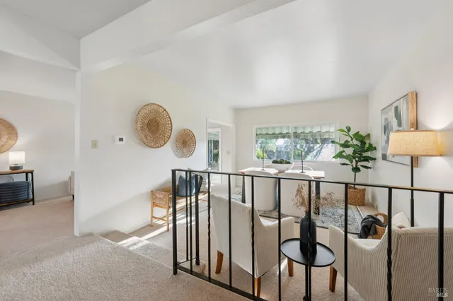 a view of hallway with furniture
