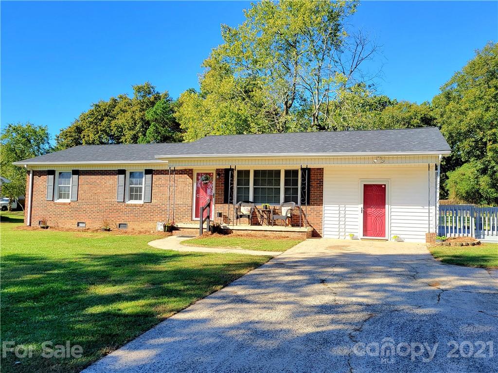 3411 Fallston Road Shelby, NC 28150 - Photo 2 of 39 a front view of a house with a yard and trees