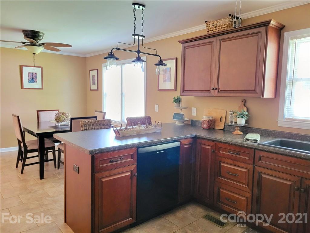 3411 Fallston Road Shelby, NC 28150 - Photo 12 of 39 a kitchen with a sink stove and cabinets