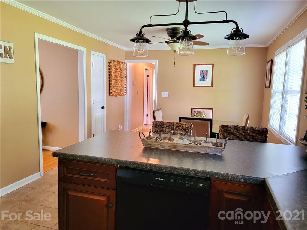 3411 Fallston Road Shelby, NC 28150 - Photo 14 of 39 a kitchen with stainless steel appliances granite countertop a sink and cabinets
