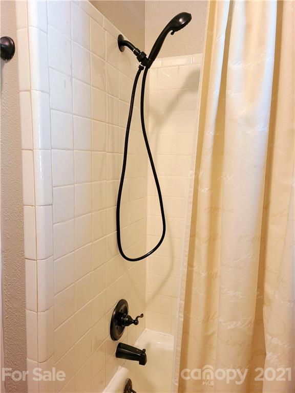 3411 Fallston Road Shelby, NC 28150 - Photo 17 of 39 a bathroom with a shower and a mirror