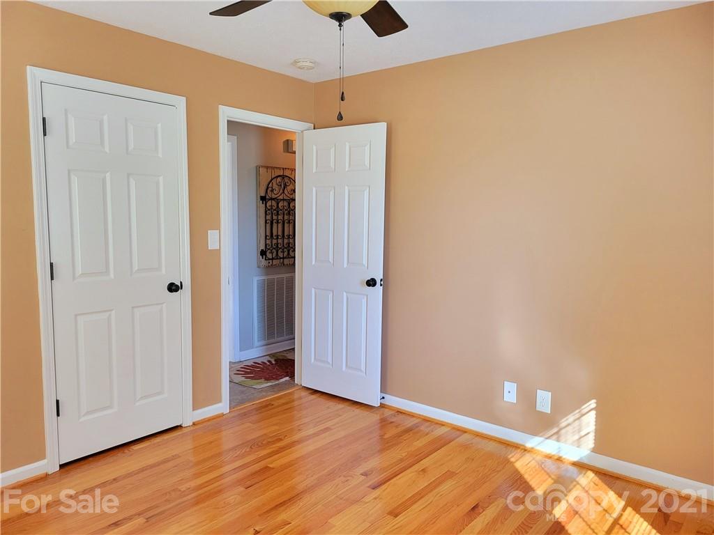 3411 Fallston Road Shelby, NC 28150 - Photo 20 of 39 a view of an empty room with window and wooden floor