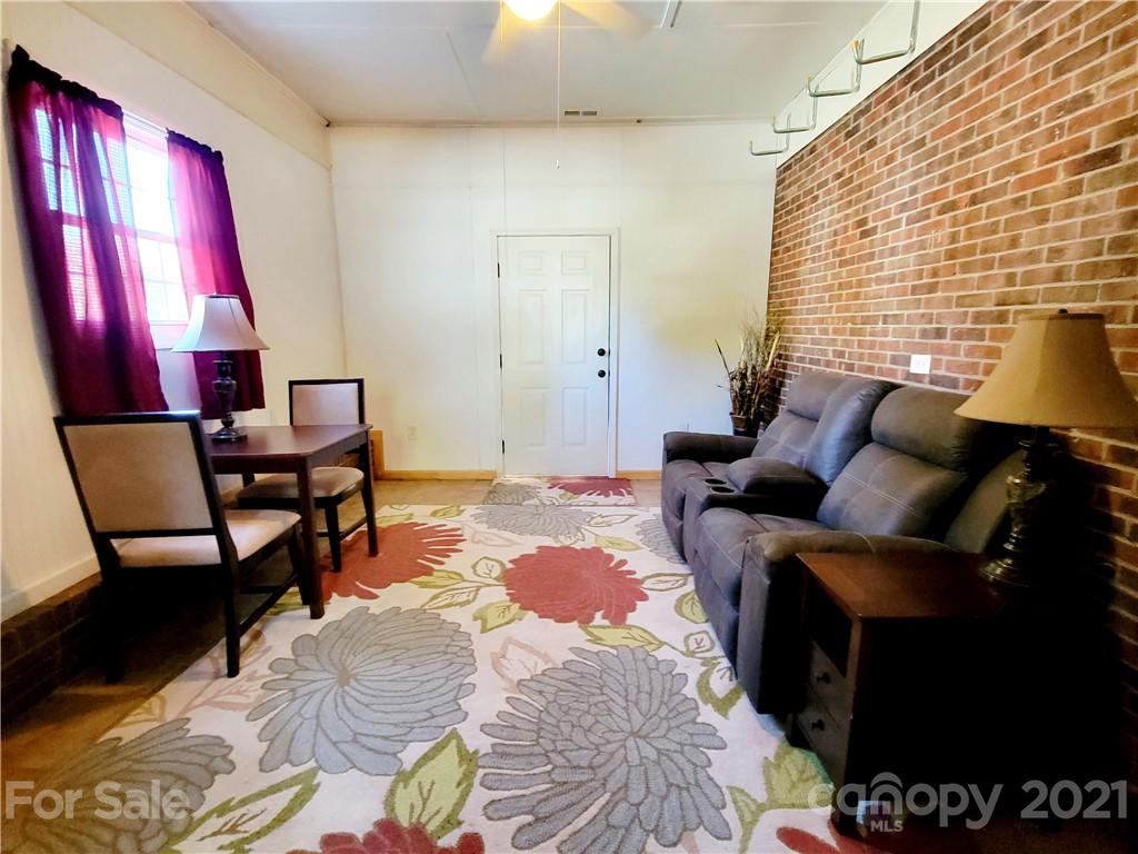 3411 Fallston Road Shelby, NC 28150 - Photo 22 of 39 a bedroom with a bed and wooden floor