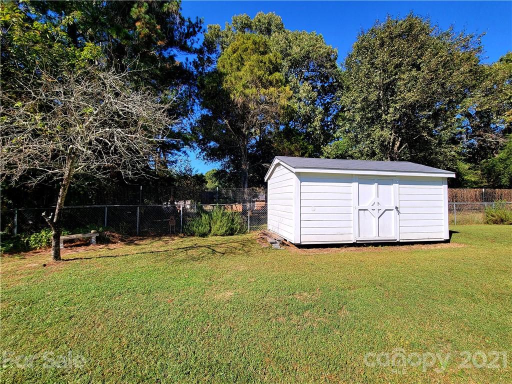 3411 Fallston Road Shelby, NC 28150 - Photo 37 of 39 a view of a house with backyard and trees