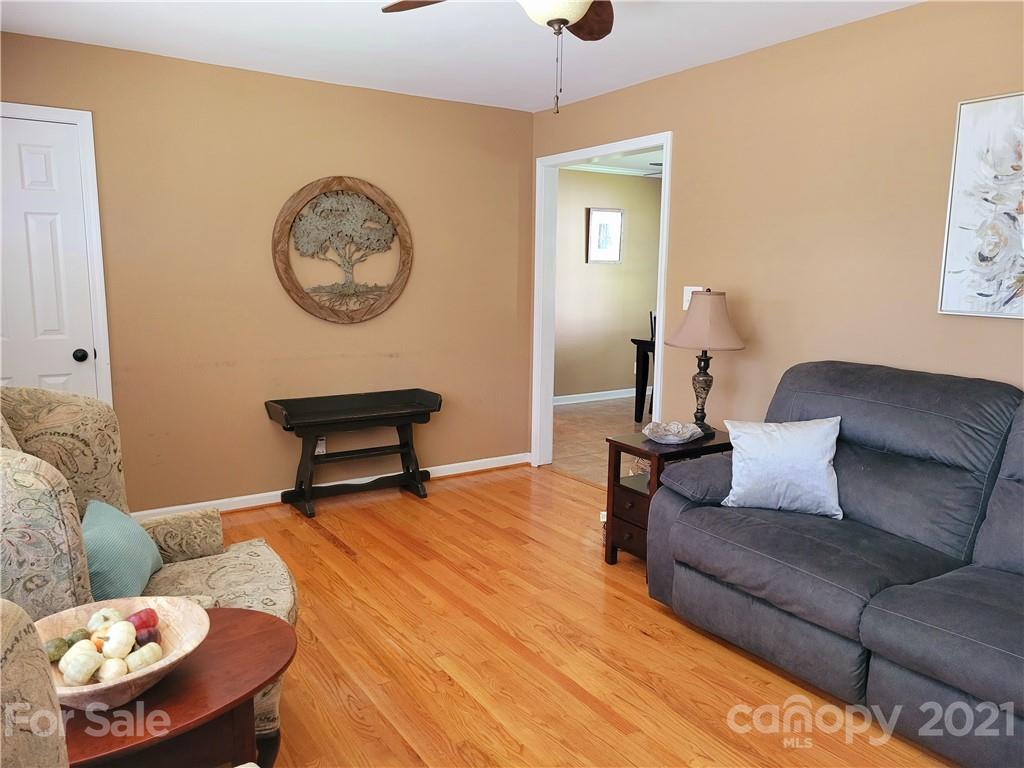 3411 Fallston Road Shelby, NC 28150 - Photo 6 of 39 a living room with furniture and a lamp