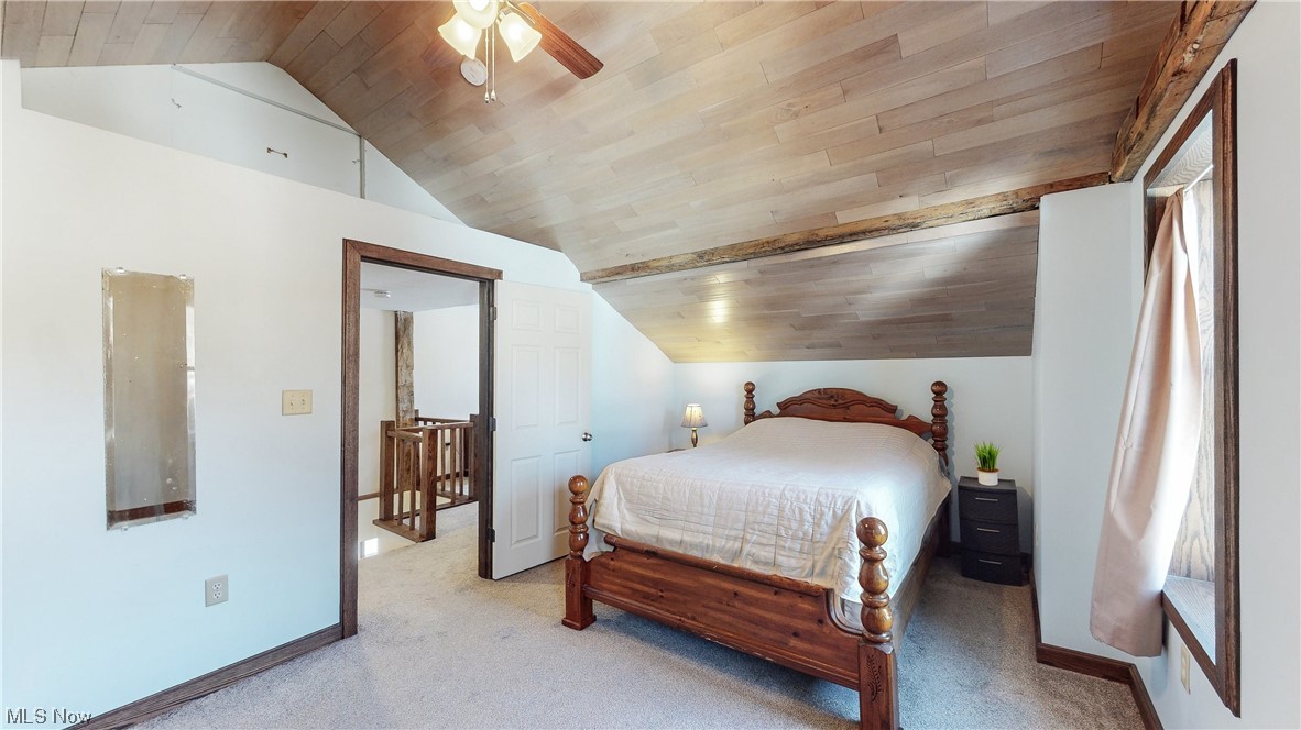 5770 Horning Road Kent, OH 44240 - Photo 26 of 50 Bedroom featuring light colored carpet, ceiling fan, wooden ceiling, and lofted ceiling