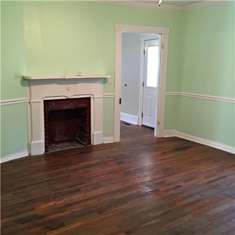950 Bugscuffle Road Wartrace, TN 37183 - Photo 3 of 12 Greet you guest as they enter you beautiful, colonial home through the lovely living room that boasts a built-in fireplace.