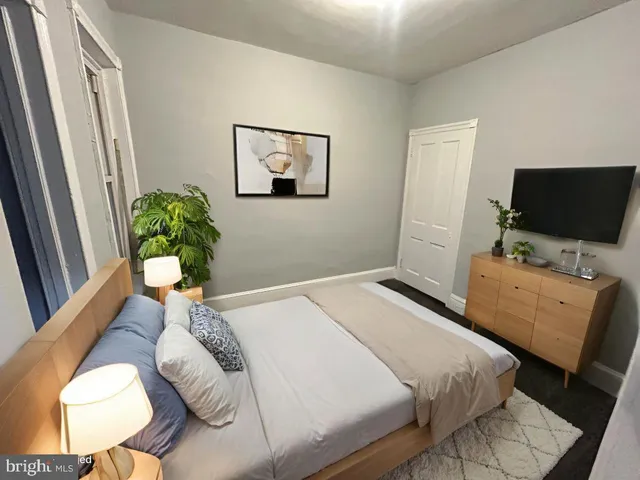 a bedroom with a bed and furniture