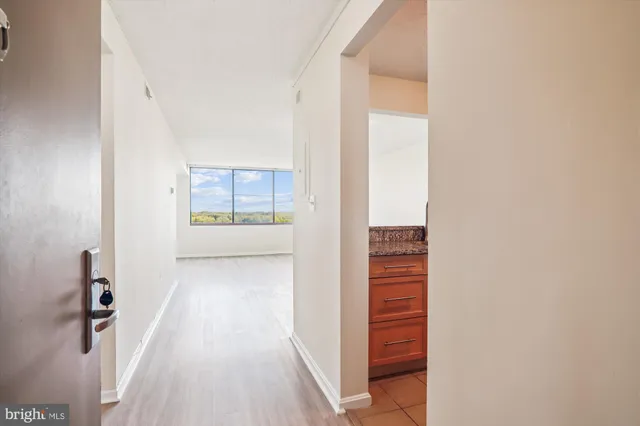 a kitchen with granite countertop a sink and a window