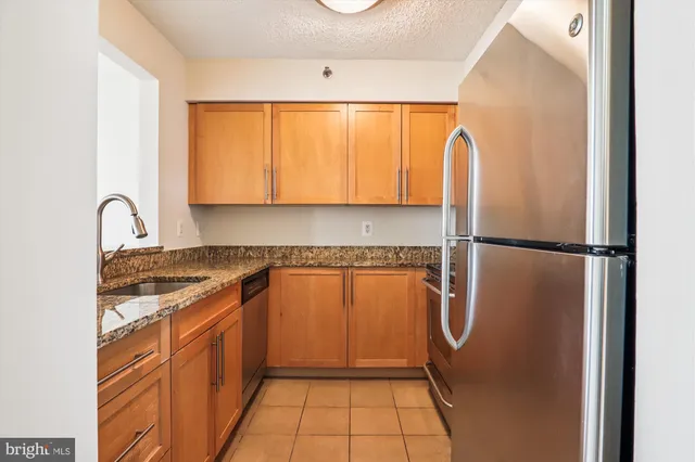 a view of room with window and wooden floor