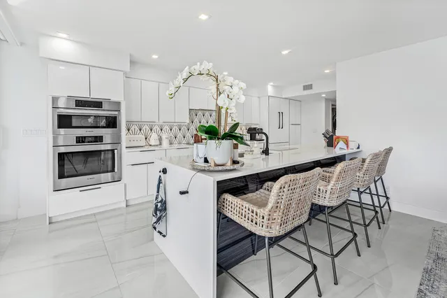 a bathroom with a granite countertop sink mirror toilet and shower