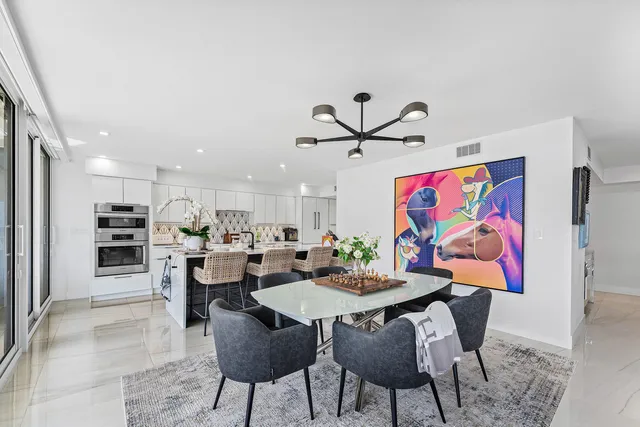 a spacious bedroom with a bed and a couch