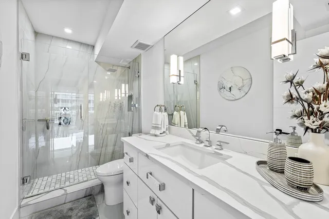 a bathroom with a double vanity sink mirror and double