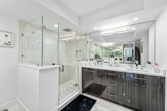 a bedroom with a large bed couch and a window