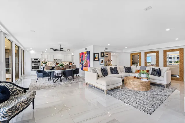 a view of a dining room with furniture wooden floor and a chandelier