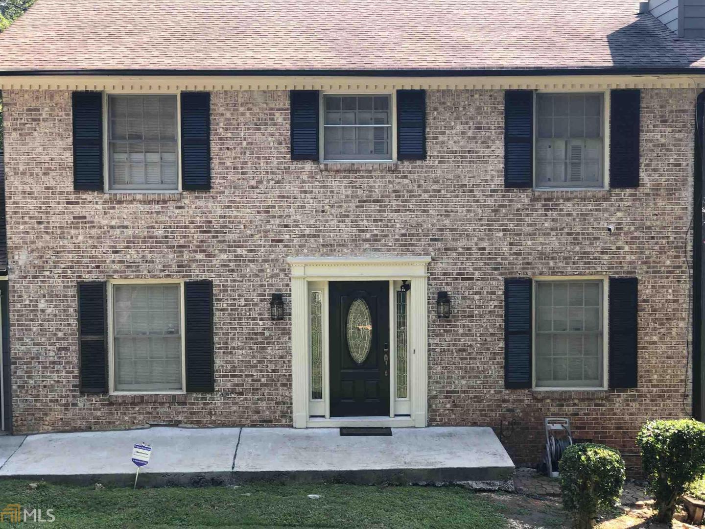 4940 Fairforest Drive Stone Mountain, GA 30088 - Photo 1 of 1 a front view of a house with a yard