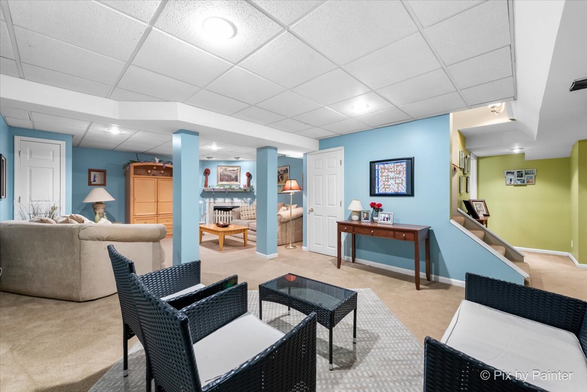 705 Cherry Tree Lane Genoa, IL 60135 - Photo 16 of 31 a living room with furniture and a wooden floor