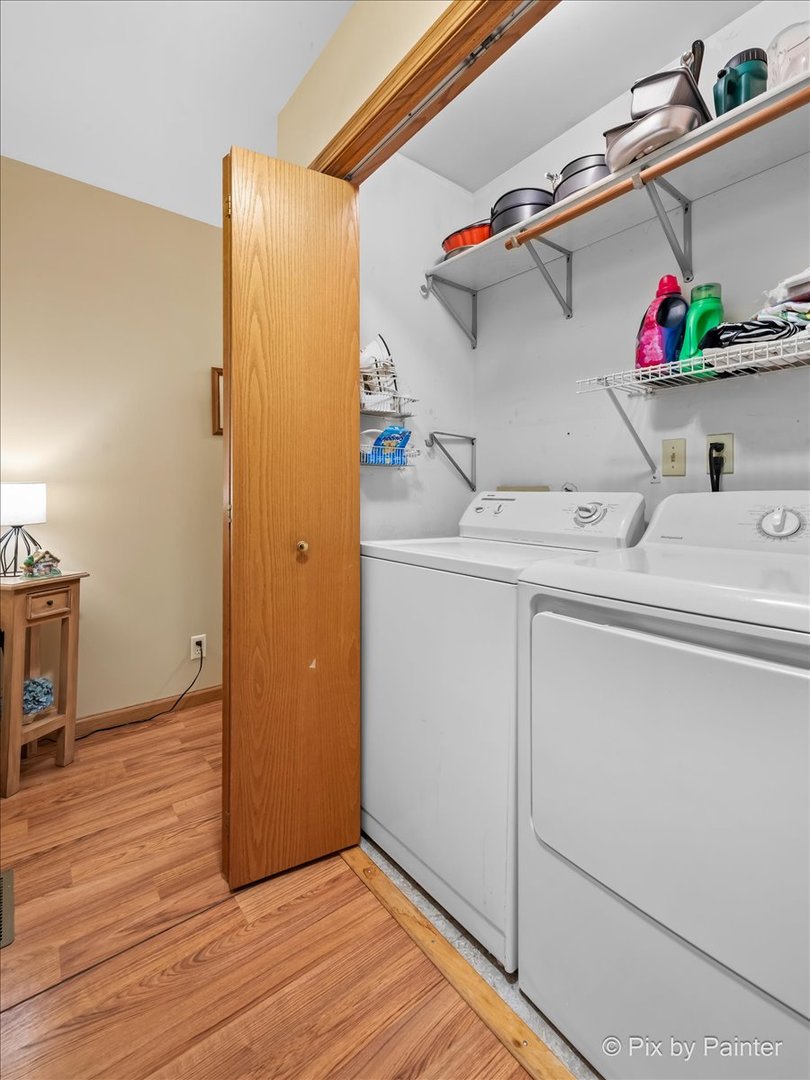 705 Cherry Tree Lane Genoa, IL 60135 - Photo 20 of 31 a utility room with cabinets washer and dryer