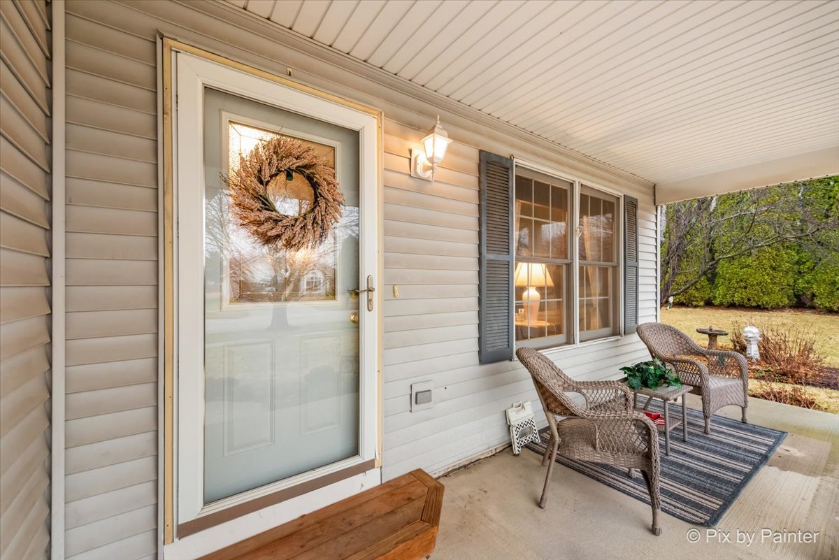 705 Cherry Tree Lane Genoa, IL 60135 - Photo 2 of 31 a outdoor space with patio the couches and a dining table with wooden floor