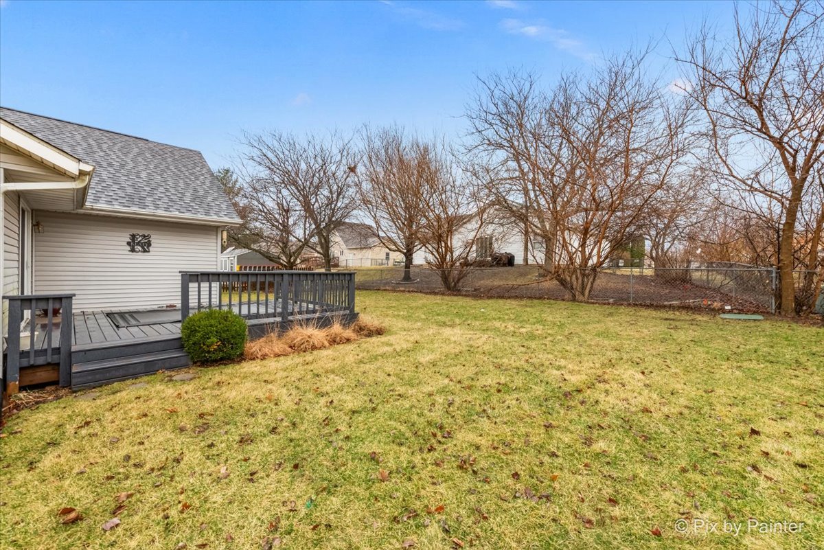 705 Cherry Tree Lane Genoa, IL 60135 - Photo 23 of 31 a view of a house with a yard