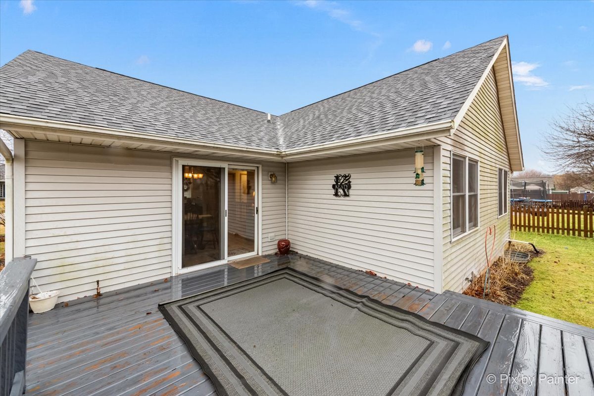 705 Cherry Tree Lane Genoa, IL 60135 - Photo 24 of 31 a view of a house with a wooden deck