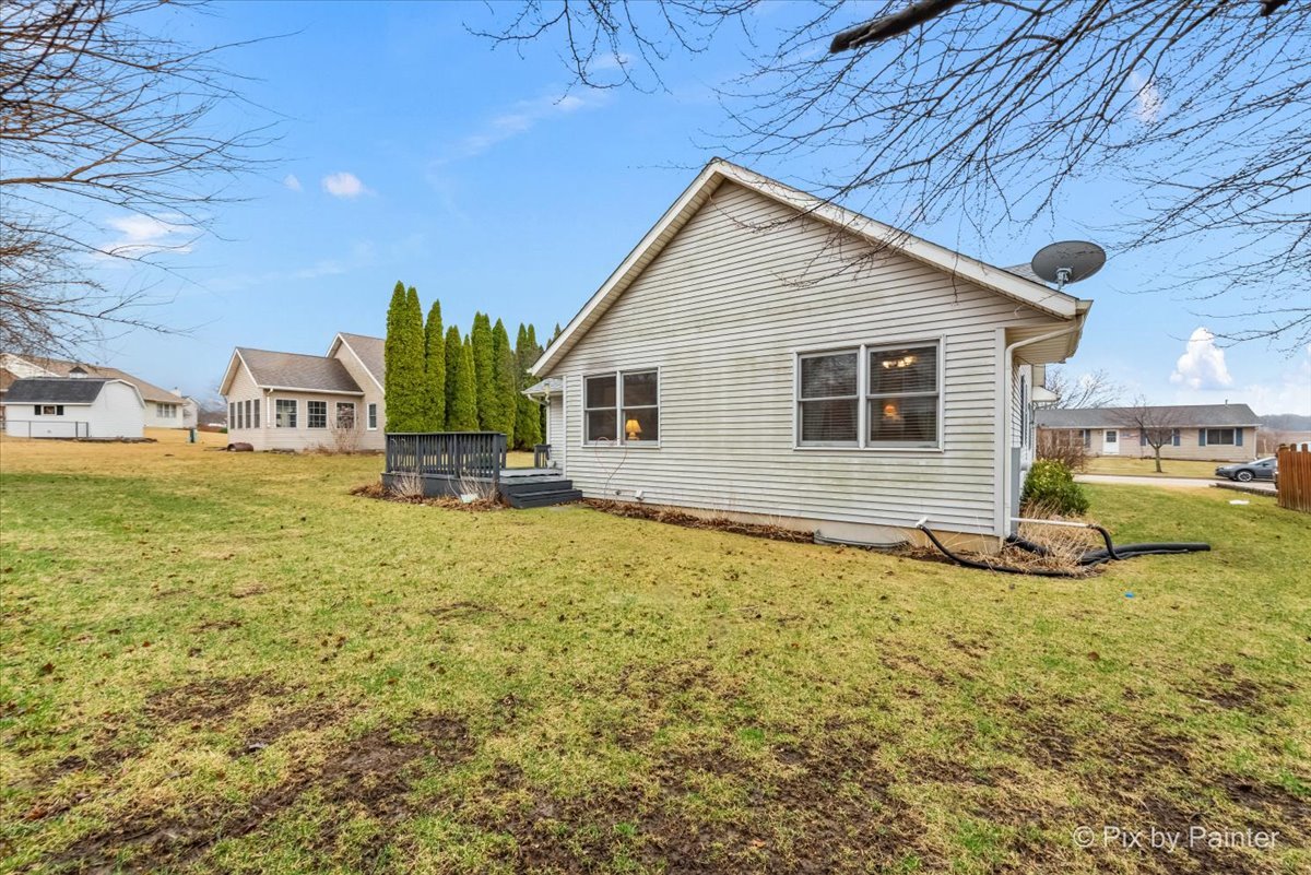 705 Cherry Tree Lane Genoa, IL 60135 - Photo 26 of 31 a view of a house with backyard porch and sitting area