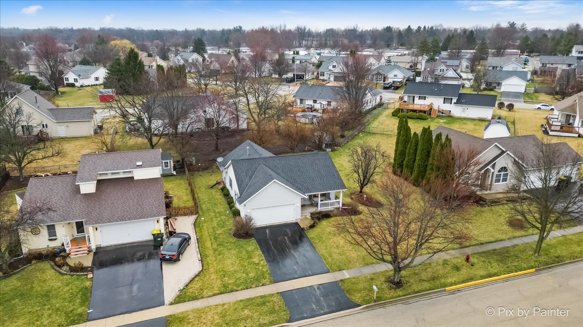 705 Cherry Tree Lane Genoa, IL 60135 - Photo 27 of 31 an aerial view of a houses with a swimming pool