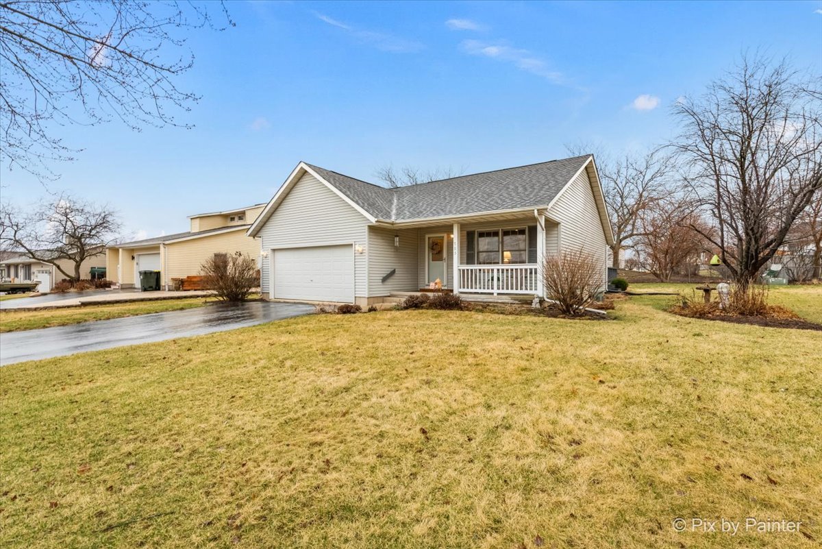 705 Cherry Tree Lane Genoa, IL 60135 - Photo 31 of 31 a house view with swimming pool in front of it