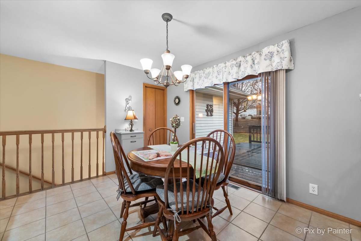 705 Cherry Tree Lane Genoa, IL 60135 - Photo 7 of 31 a view of a dining room with furniture window and outside view