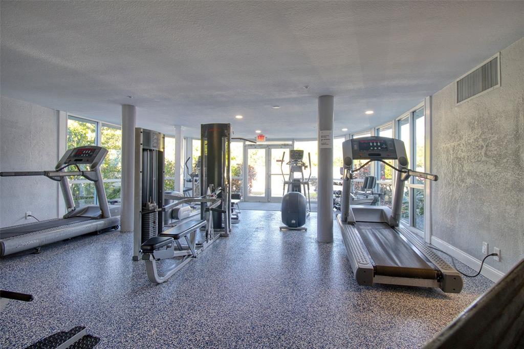 3315 58th Avenue South, Unit 112 St. Petersburg, FL 33712 - Photo 19 of 38 a living room with furniture and a table