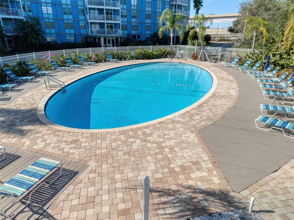 3315 58th Avenue South, Unit 112 St. Petersburg, FL 33712 - Photo 30 of 38 a view of a swimming pool with a patio
