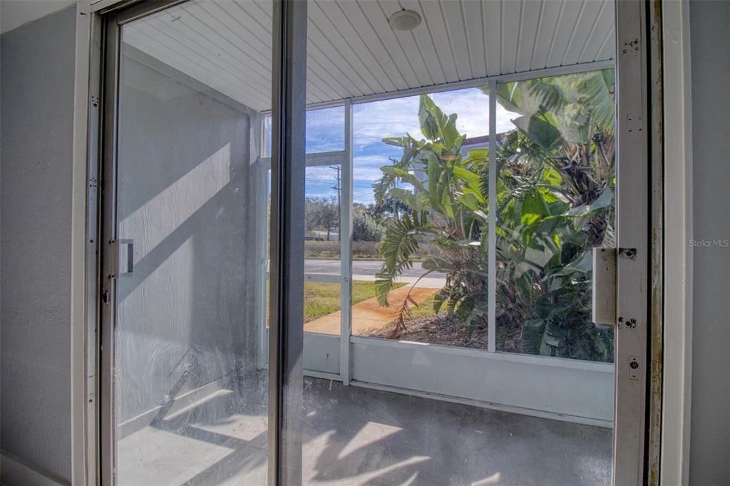 3315 58th Avenue South, Unit 112 St. Petersburg, FL 33712 - Photo 6 of 38 a view of a glass door and porch