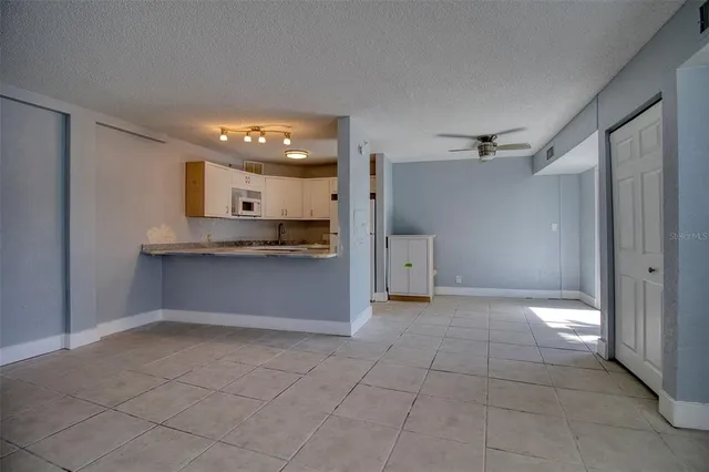 a kitchen with stainless steel appliances a sink and a refrigerator