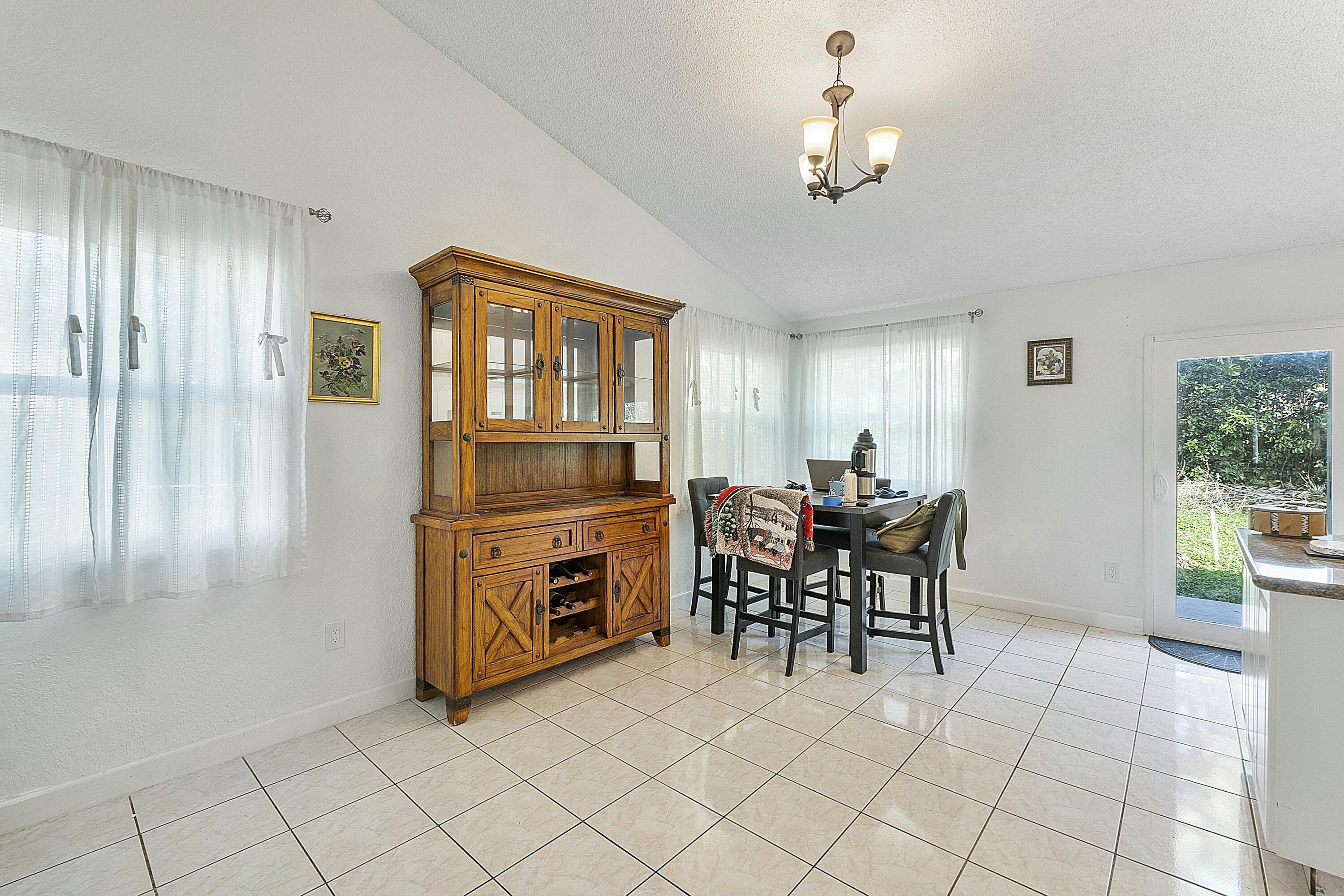 8143 Cedar Hollow Lane Boca Raton, FL 33433 - Photo 11 of 29 a dining room well furnished
