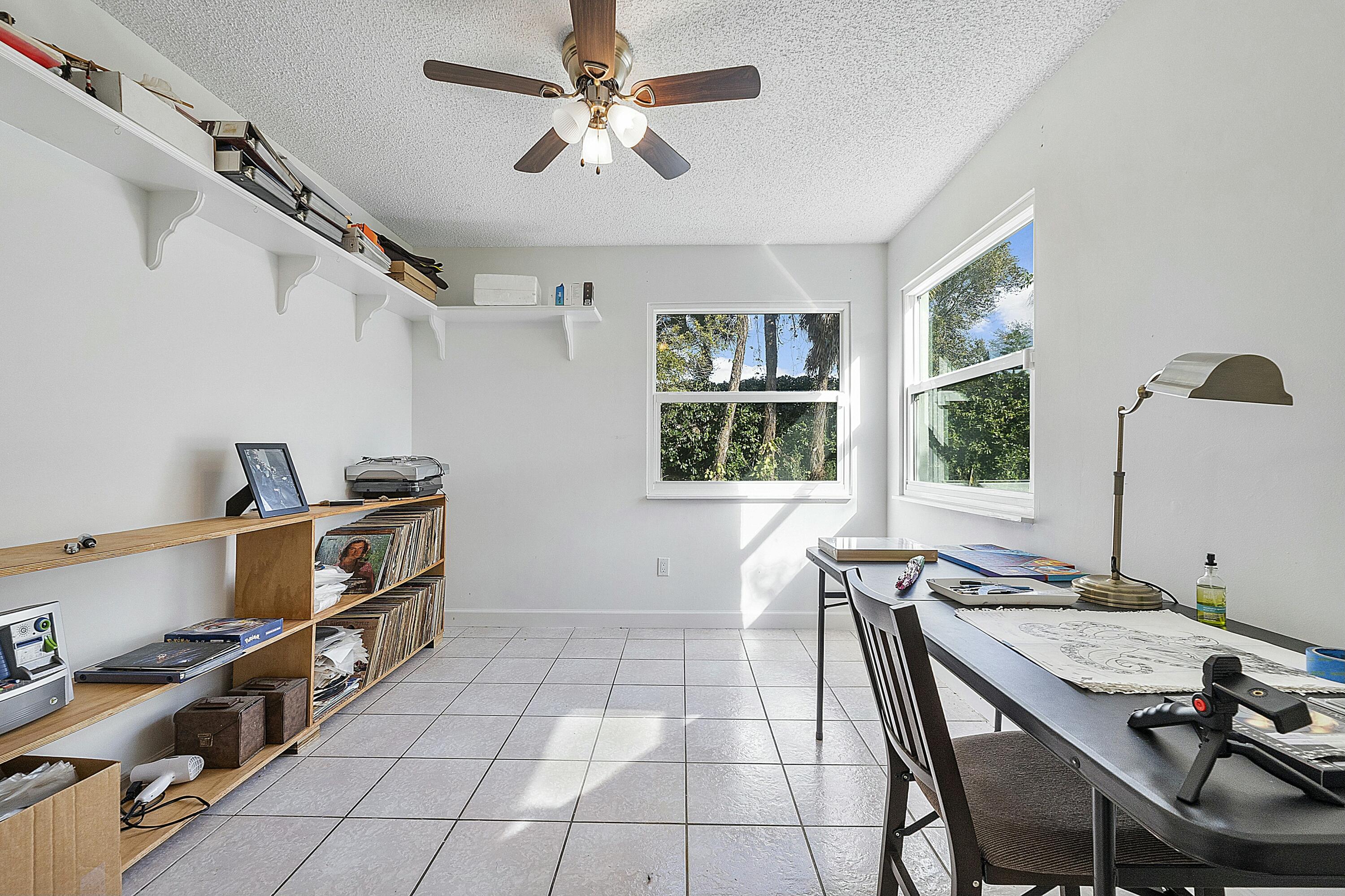 8143 Cedar Hollow Lane Boca Raton, FL 33433 - Photo 21 of 29 a view of a workspace with furniture and a window