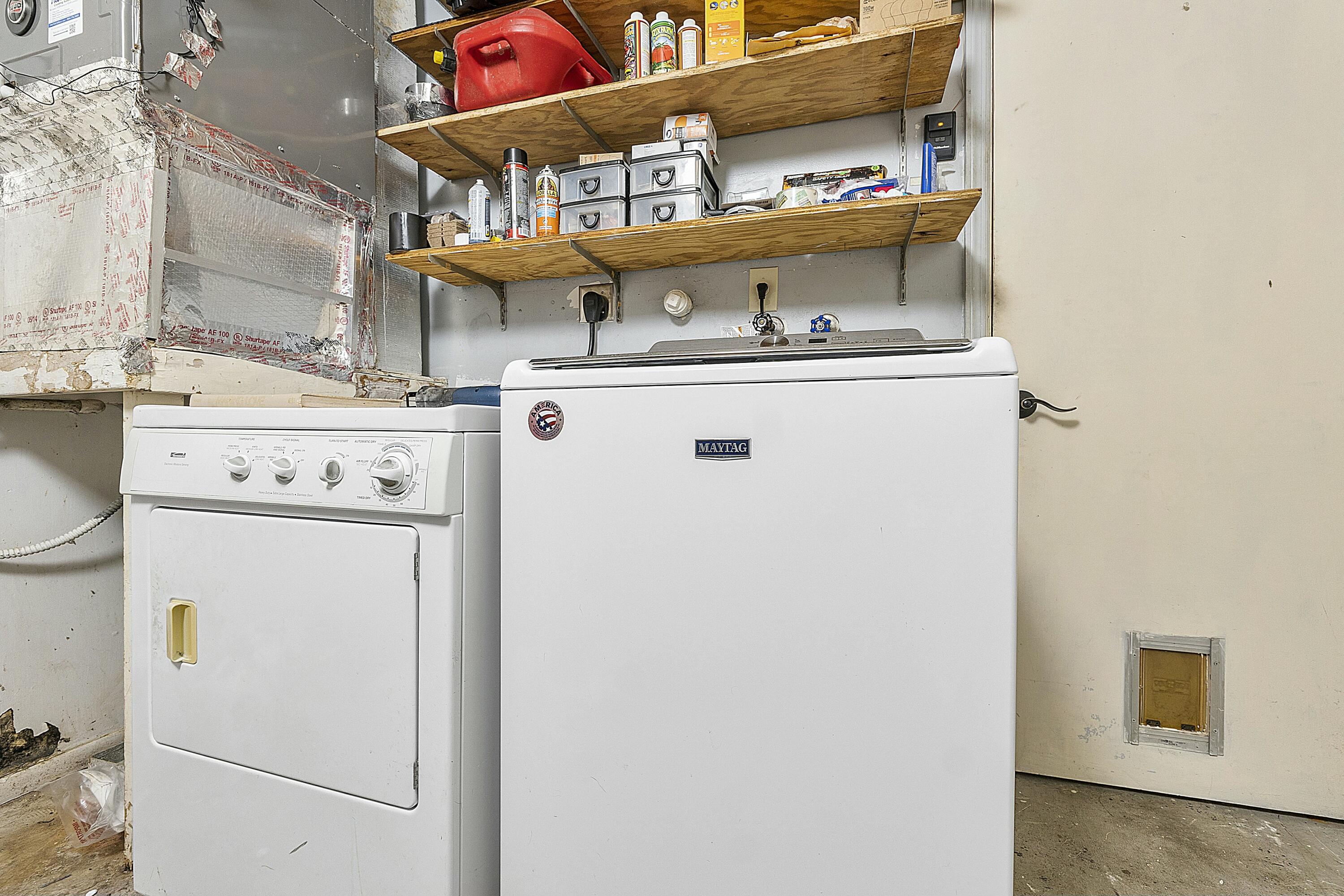 8143 Cedar Hollow Lane Boca Raton, FL 33433 - Photo 24 of 29 a utility room with dryer and washer