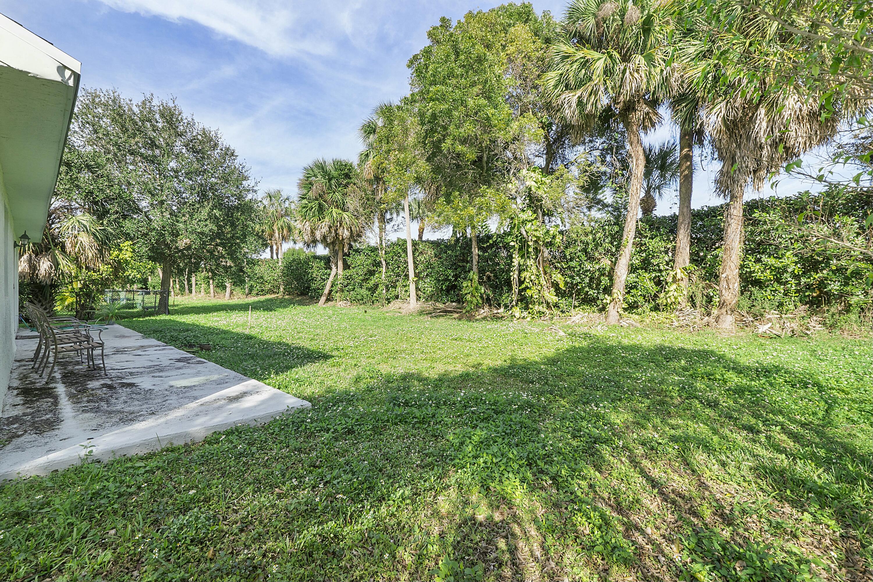 8143 Cedar Hollow Lane Boca Raton, FL 33433 - Photo 26 of 29 a large green field with lots of trees