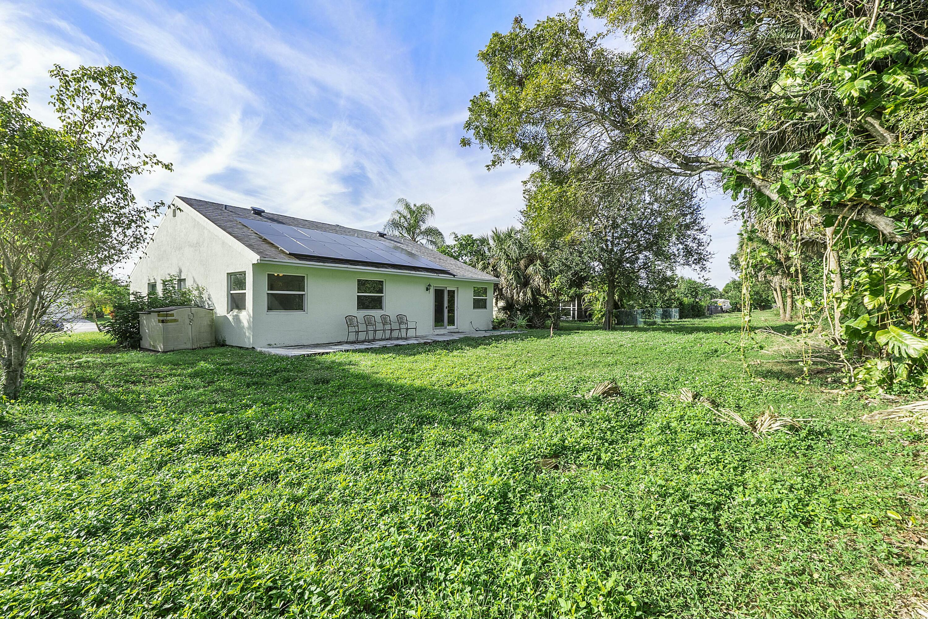 8143 Cedar Hollow Lane Boca Raton, FL 33433 - Photo 27 of 29 a view of a house with backyard and garden