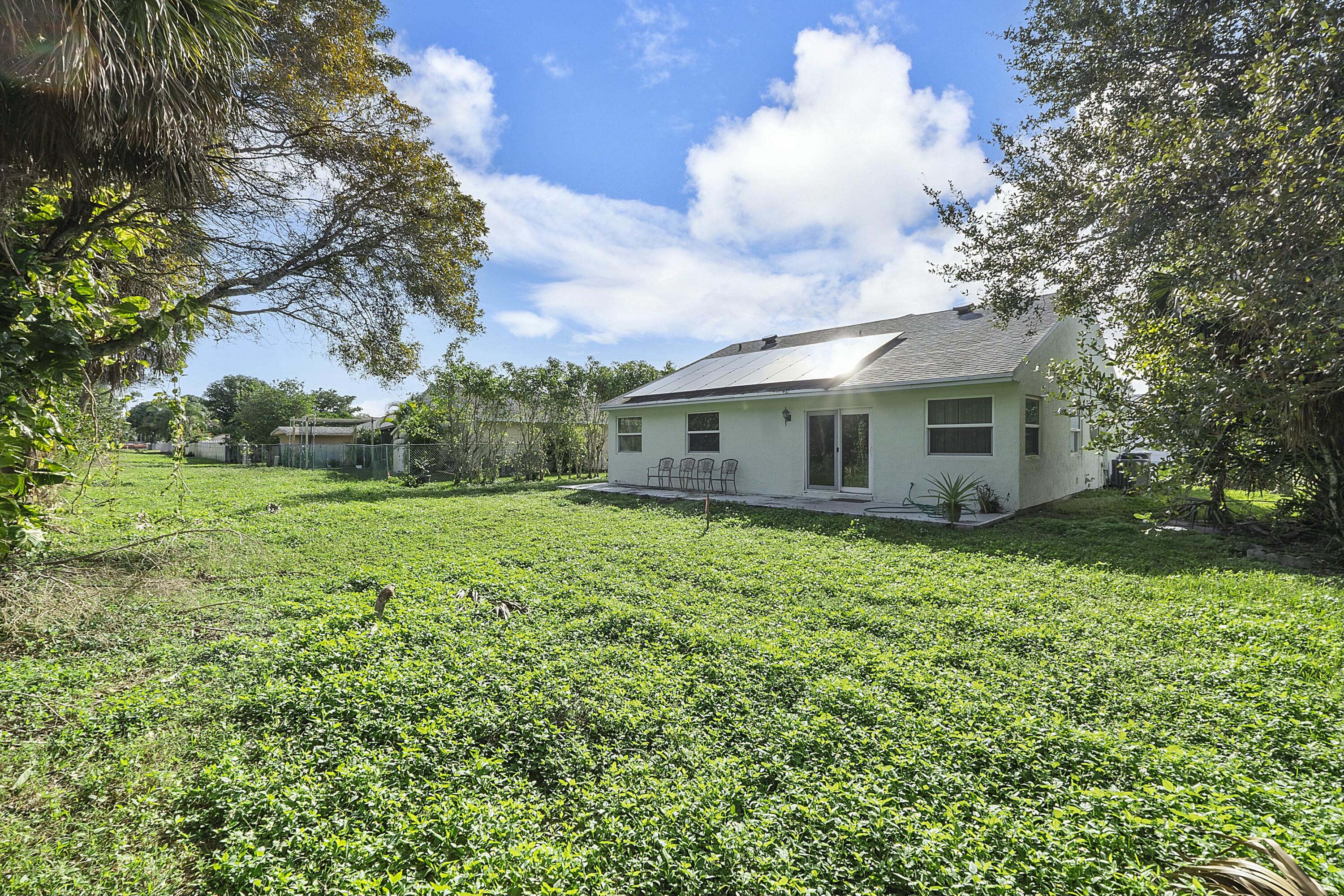 8143 Cedar Hollow Lane Boca Raton, FL 33433 - Photo 29 of 29 a view of a house with backyard