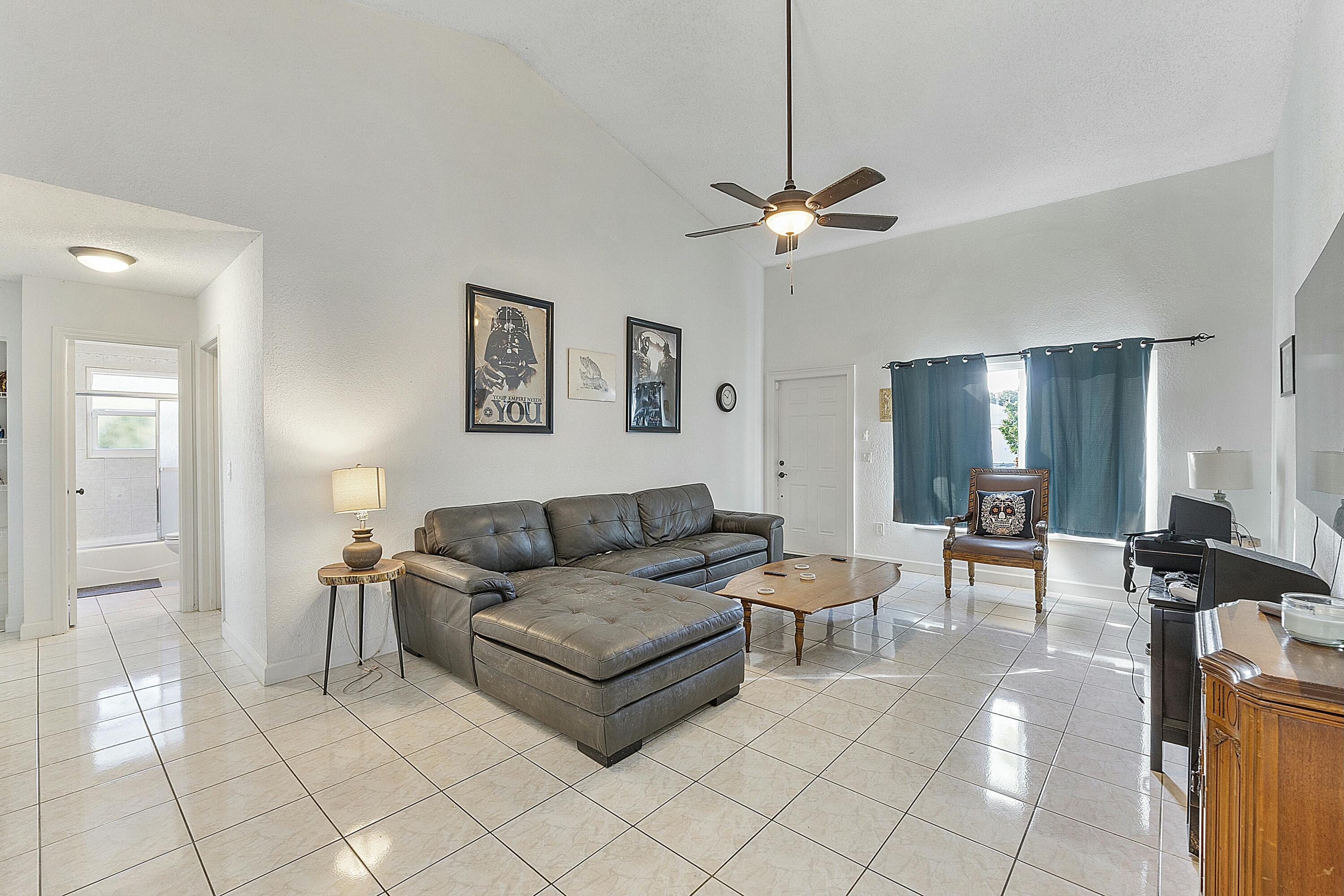 8143 Cedar Hollow Lane Boca Raton, FL 33433 - Photo 8 of 29 a living room with furniture and wooden floor